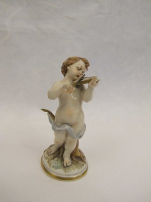 Early 20th Century little angel player