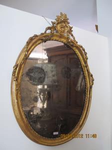 Late 19th Century oval gilt mirror